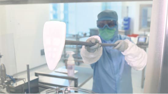 Operator cleaning a cleanroom with a Klercide disinfectant