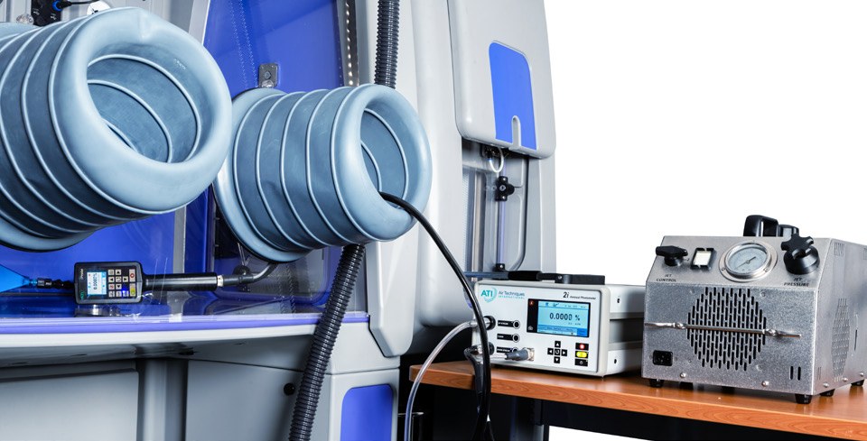 Bioquell Qube glove ports with validation instruments on the bench