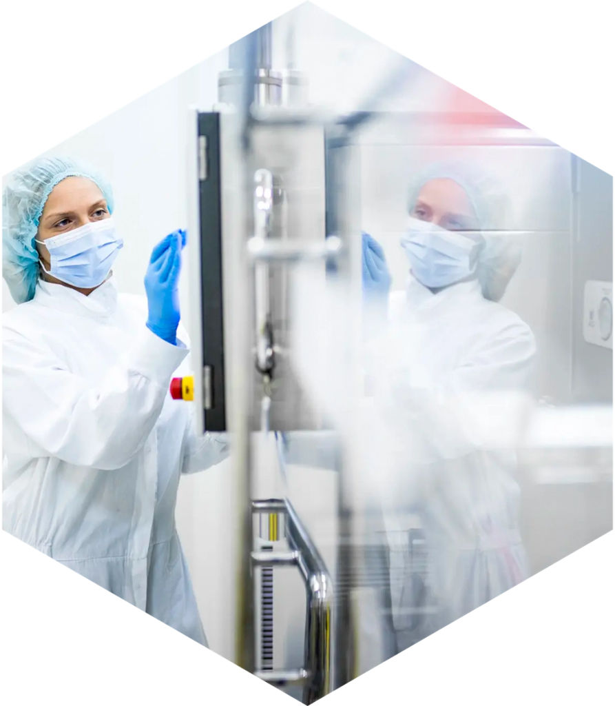 Operators at a cleanroom control panel